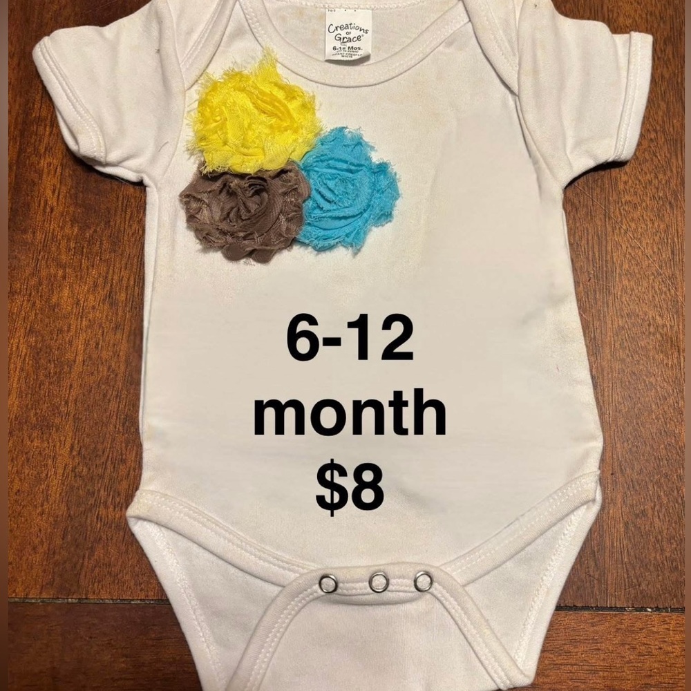 White Baby Onesie with Floral Accents. All baby onesies and bloomers are new